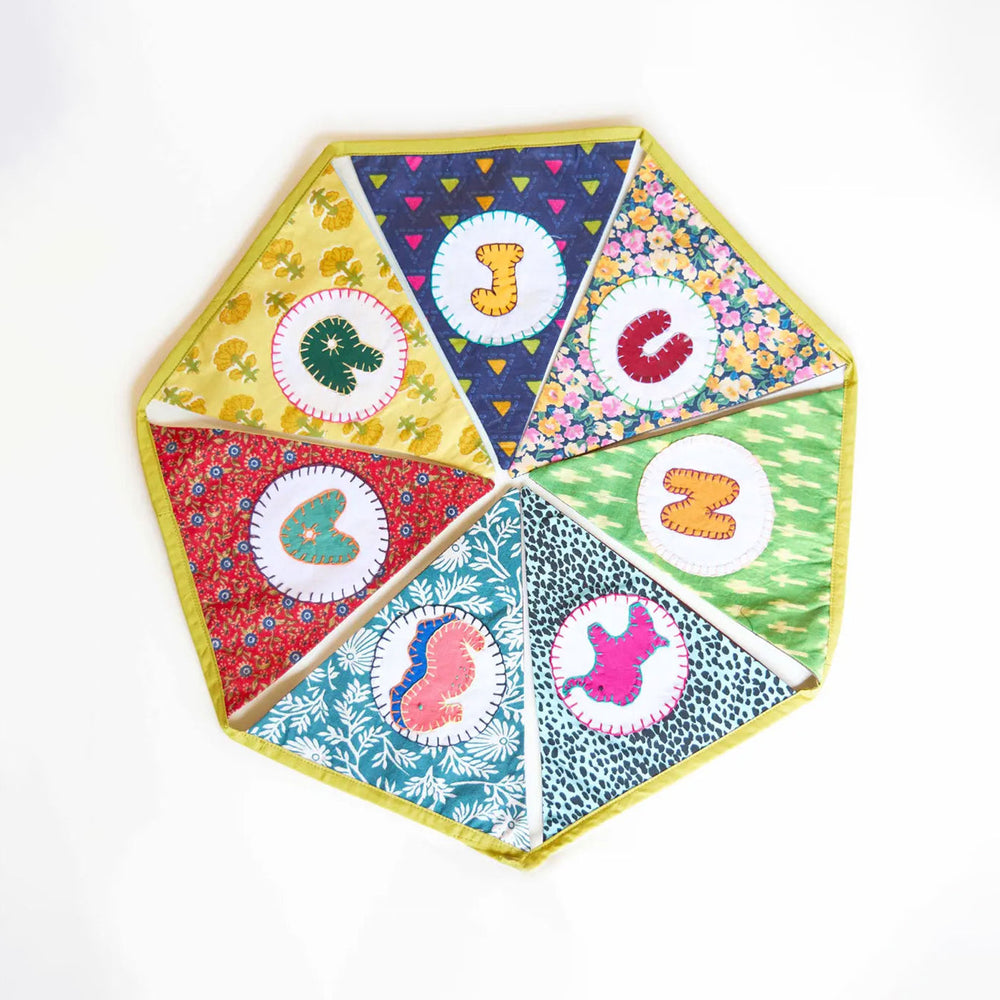 Upcycled Personalized Kids Theme Name Bunting 10 - Top-Down View of Fabric Patchwork