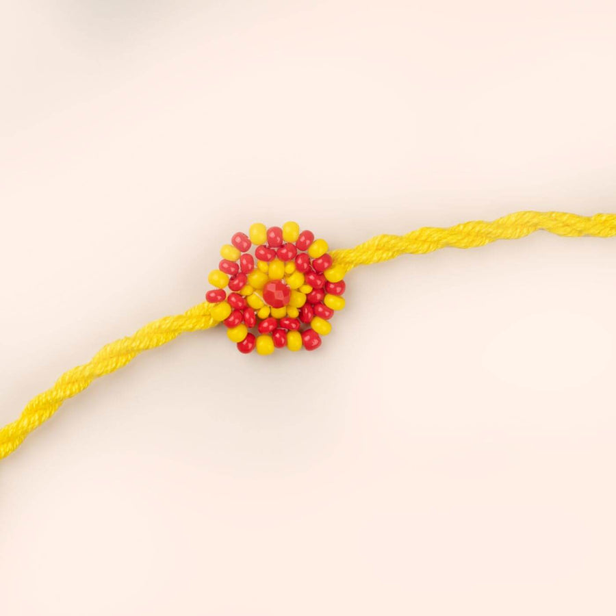Handcrafted Glass Beads Chaand Rakhi 2 - Close-up of Red Beaded Rakhi