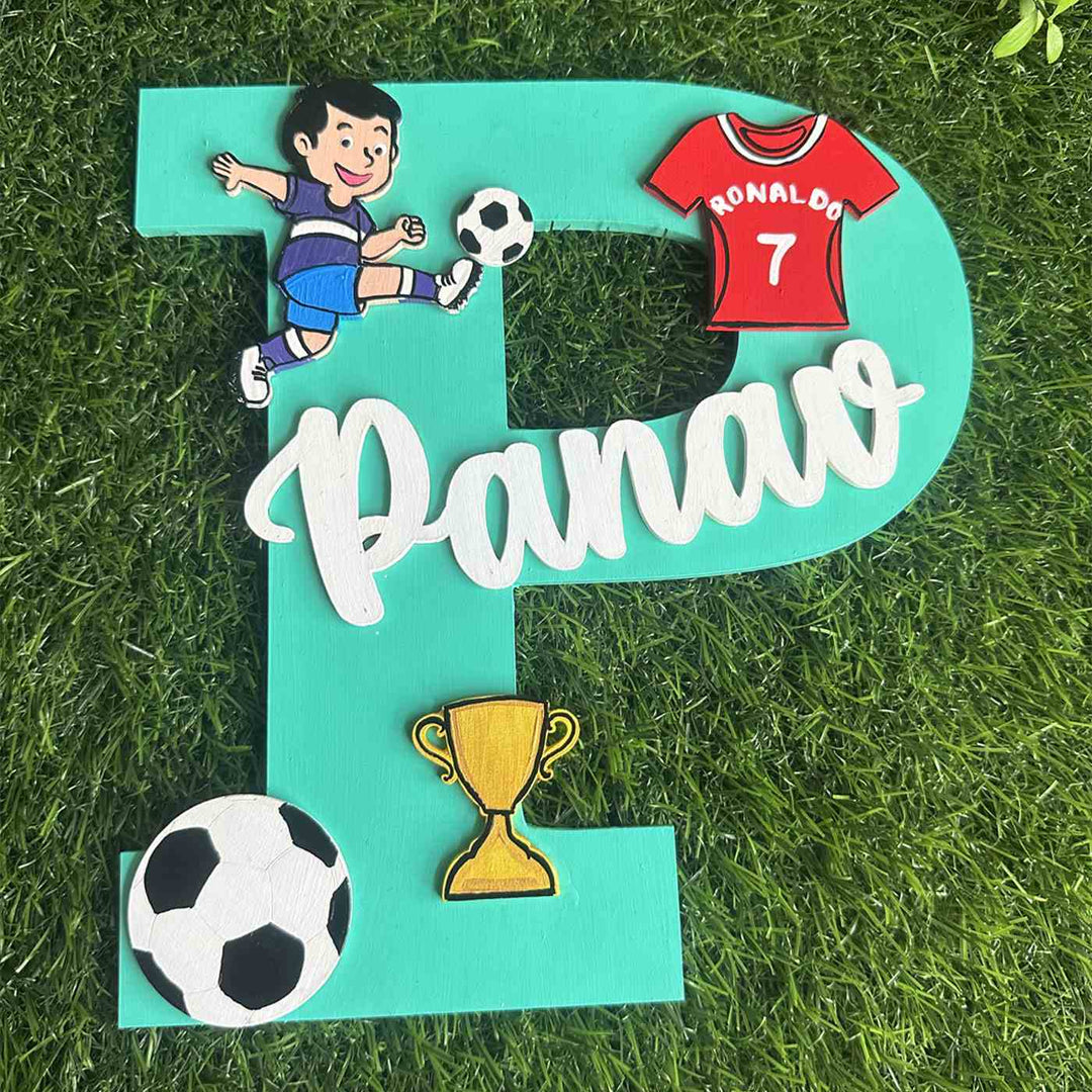 Handcrafted Personalized Kids Football Themed Monogram Mdf Nameplate 6 - Top-down View on Grass Surface