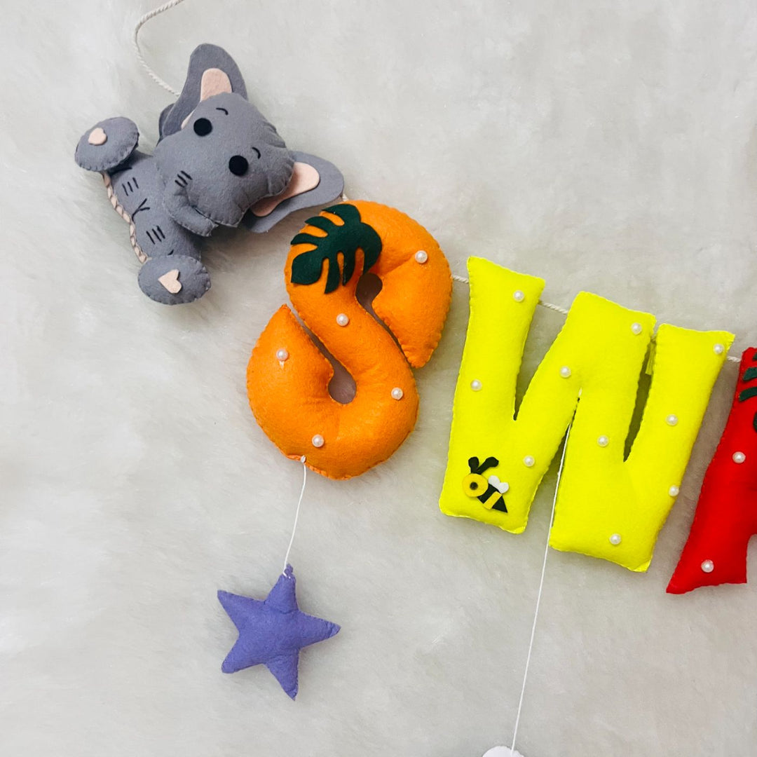 Handcrafted Personalized Ele Monkey Bunting For Kids - Close-up of Hanging Letter Garland