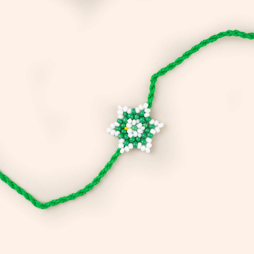 Handcrafted Glass Beads Phool Rakhi 1 - Close-up of Green Star Bracelet
