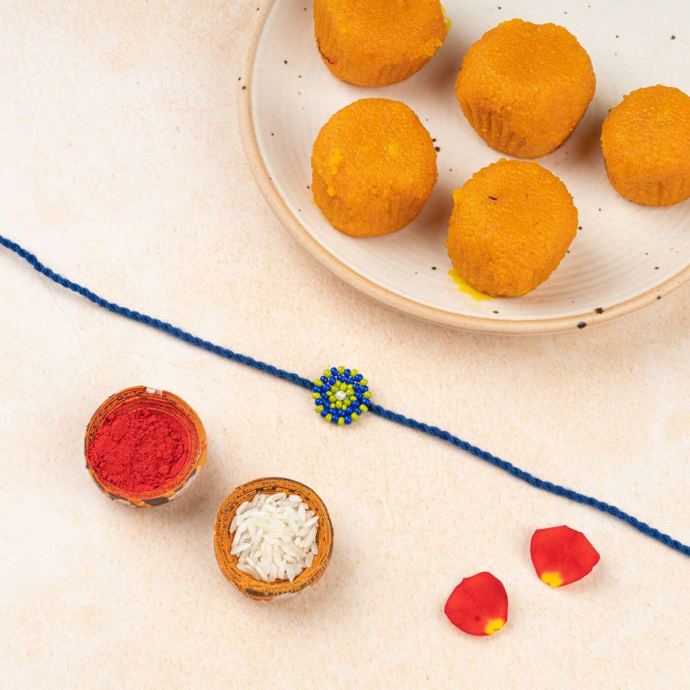 Handcrafted Glass Beads Chaand Rakhi 4 - Flat Lay with Festival Items