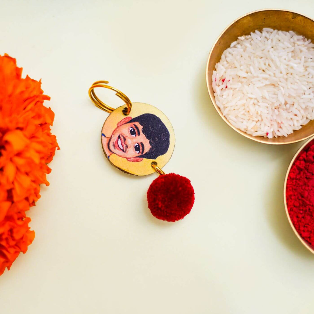 Handpainted Personalized Caricature Rakhi With Roli Chawal - Keychain with accessories close-up