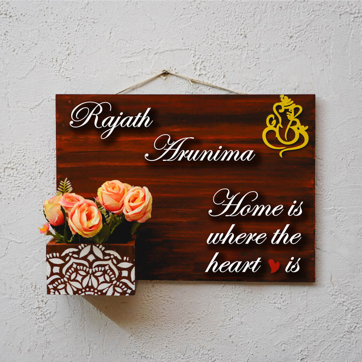 Hand Painted Personalized Wooden Name Plate With Planter 1 - Front View Hanging on Wall