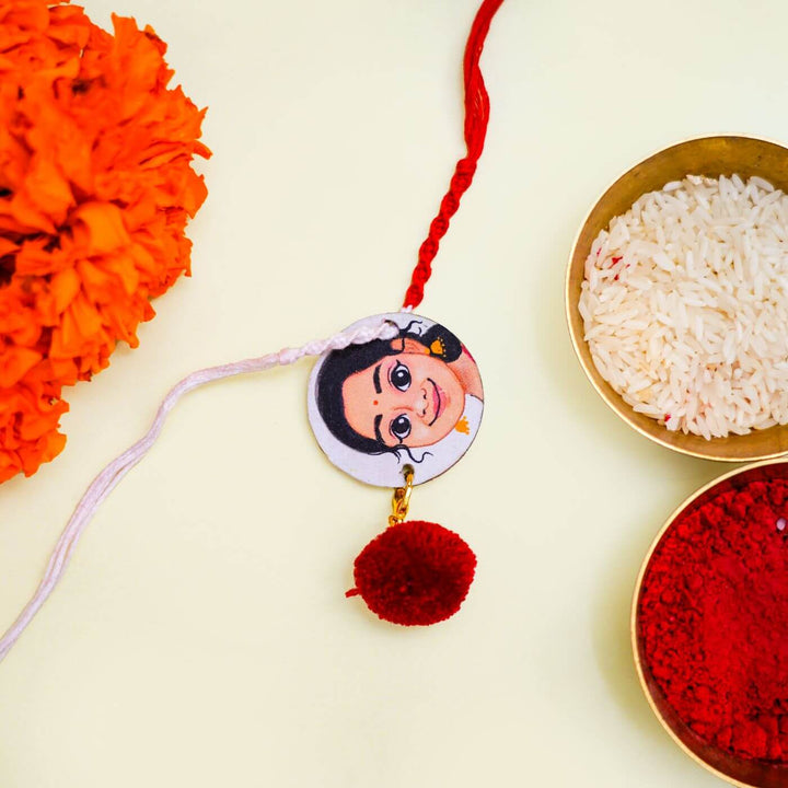 Handpainted Personalized Caricature Rakhi With Roli Chawal 2 - Festive Setting with Rakhi Close-up