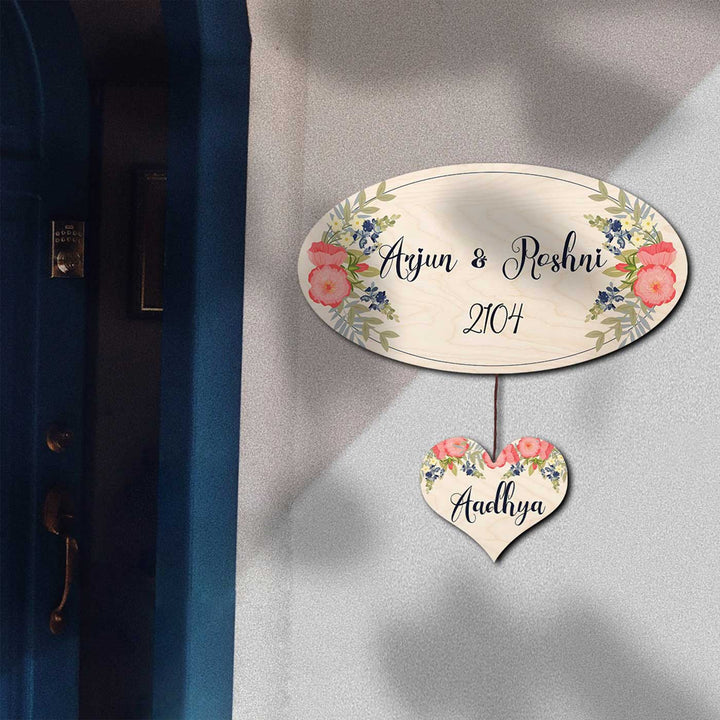 Printed White Floral Wooden Oval Nameplate For Couples - Hanging on Exterior Wall Near Door