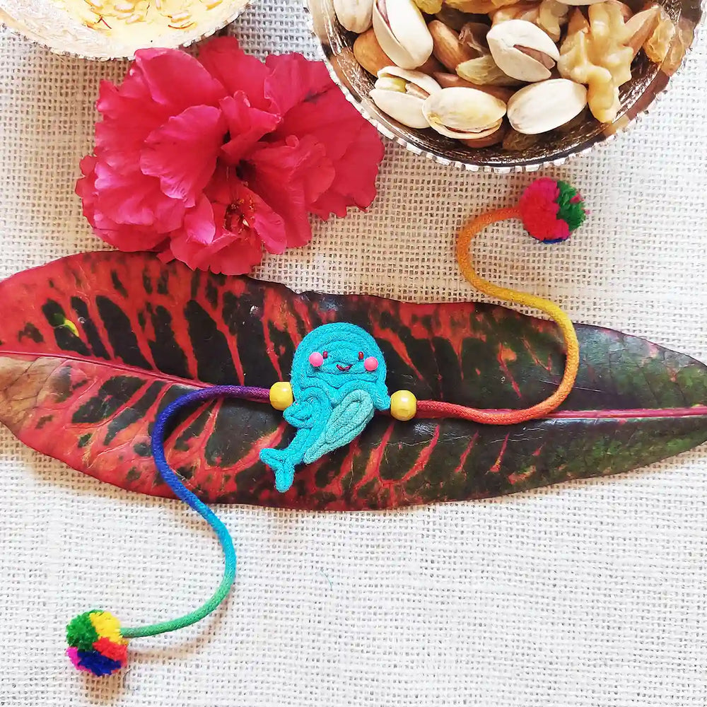 Handmade Dori Work Blue Fish Kids Rakhi With Roli Chawal - Styled with Natural Decorations