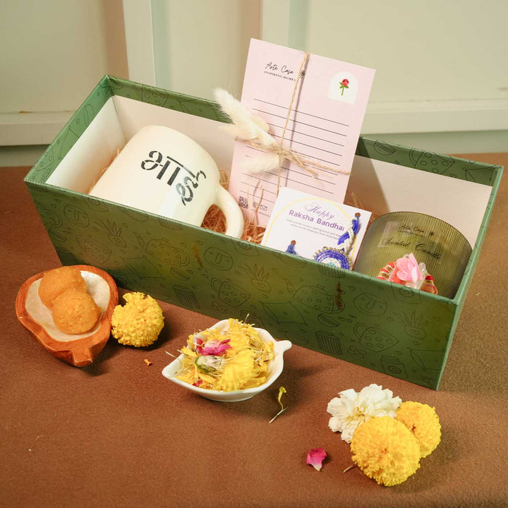 Personalized Handmade Love Theme Rakhi Hamper Includes 1 Gift Box 1 Mug 2 Rakhis 1 Roli Chawal 1 Candle And 1 Message Card - Gift Set in Box Display