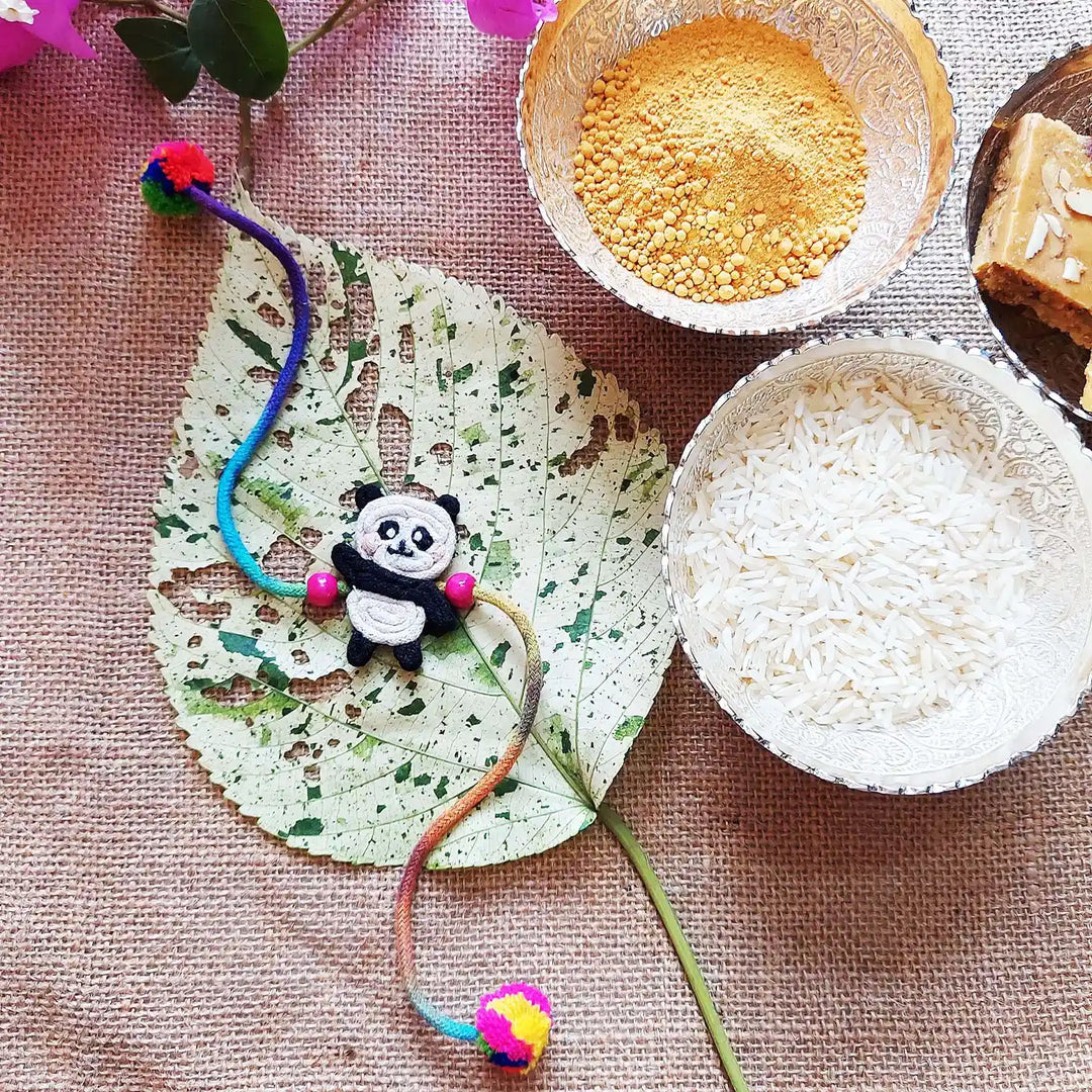 Handmade Dori Work Cute Panda Kids Rakhi With Roli Chawal - Styled with Decorative Bowls