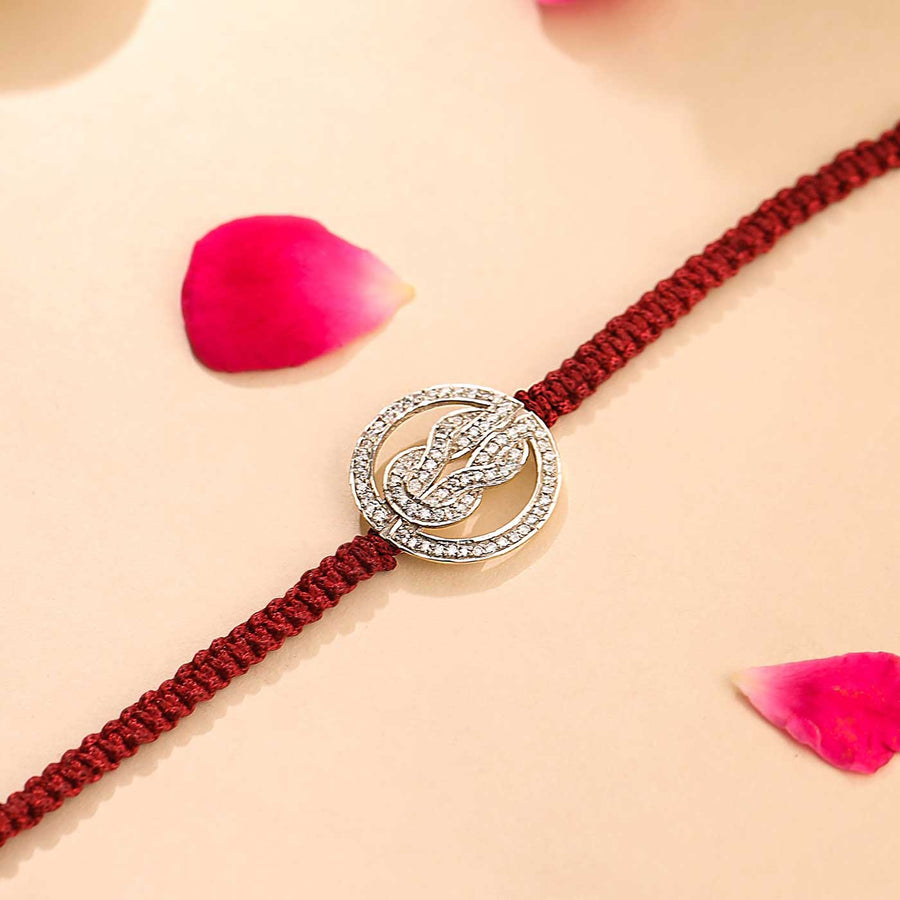 Handmade Knot Design Silver Rakhi For Brother - Close-up Detail with Rose Petals