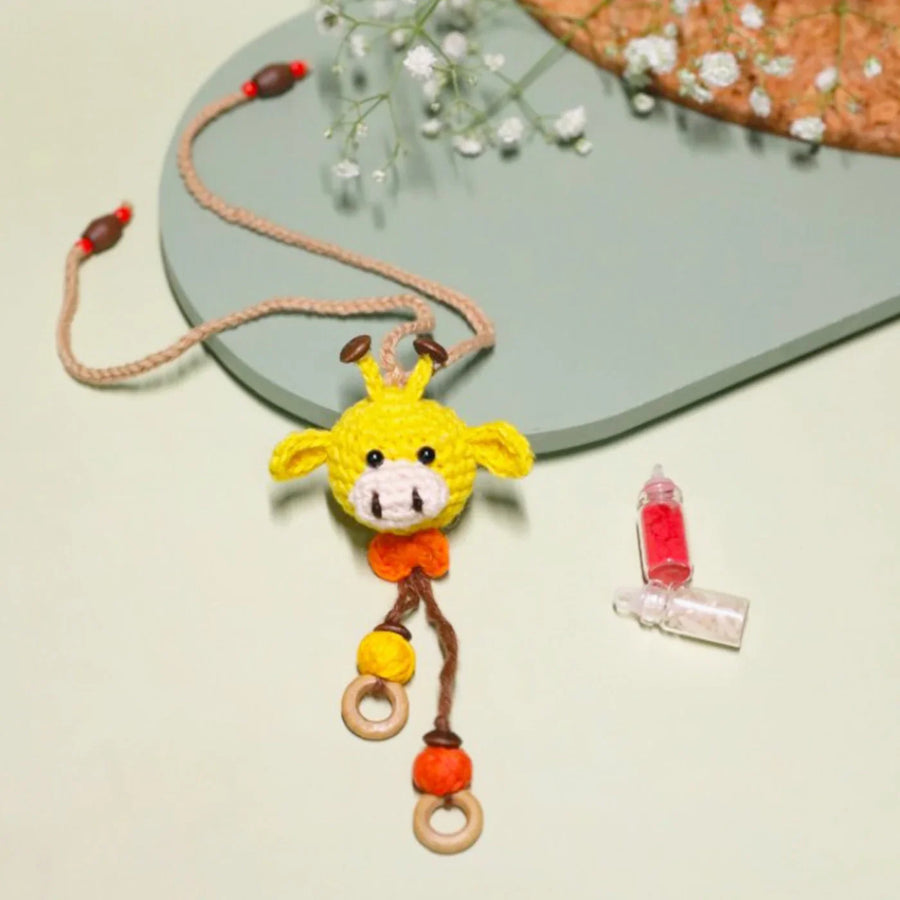 Handmade Crochet Giggling Giraffe Kids Lumba Rakhi For Girls With Roli Chawal - Front View