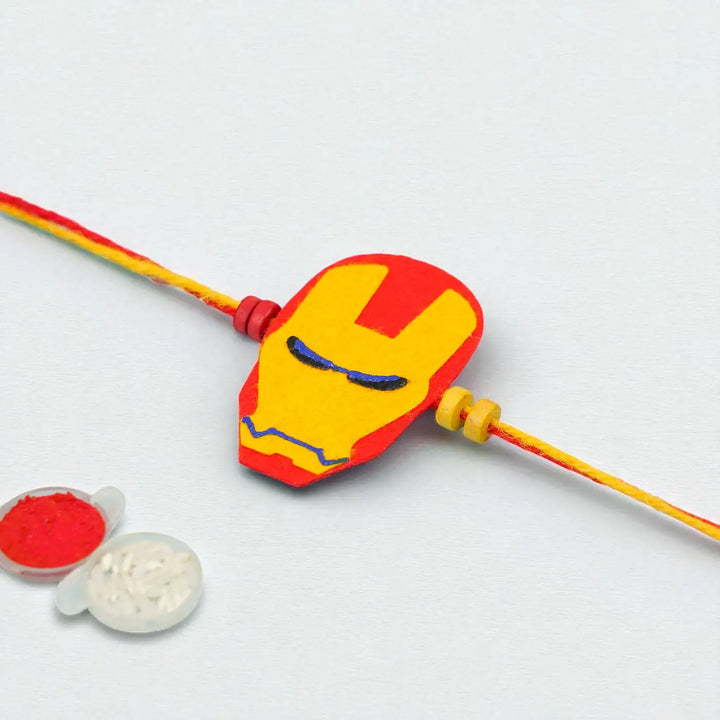 Photo Personalized Iron Man Theme Felt Rakhi Hamper With Roli Chawal Includes 1 Magnetic Photo Frame 1 Rakhi - Close-up of Bracelet Charm