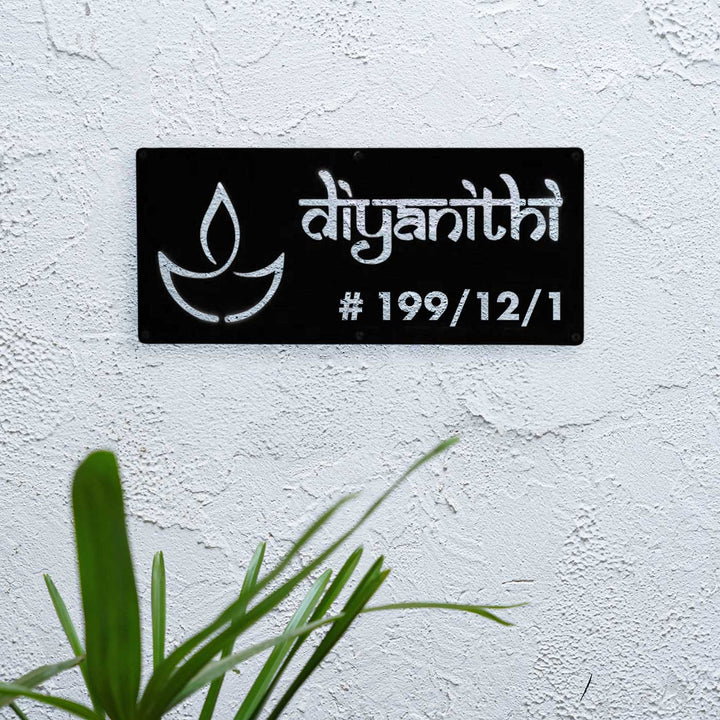 Personalized Waterproof Diya Design Laser Cut Metal Led Name Plate - Mounted on White Textured Wall