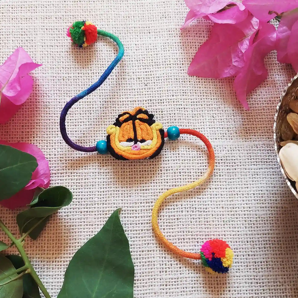 Handmade Dori Work Garfield Kids Rakhi With Roli Chawal - Styled with Decorative Props