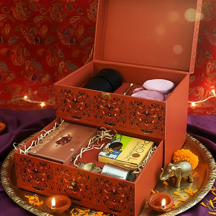 The Heritage Bloom Premium Diwali Gift Hamper | Includes 1 Brass Diya, 1 Air Purifier, 1 Prayer Bell, 2 Dry Fruit Jars, 1 Doda Barfi, 1 Incense Cones Pack, 1 Candle Holder, 1 Gift Box