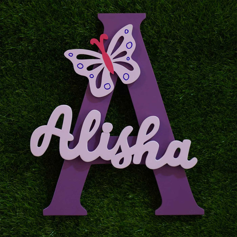 Personalized Mdf Wood Kids Monogram Name Plate - Front View on Grass Background