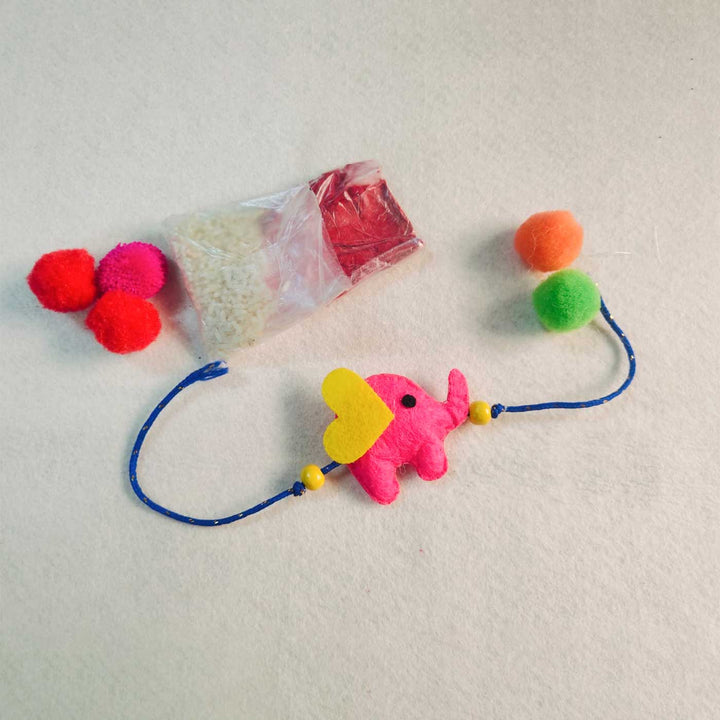 Customized Handmade Beaded Elephant Theme Pom Pom Felt Rakhi With Roli Chawal For Kids - Included Items Display