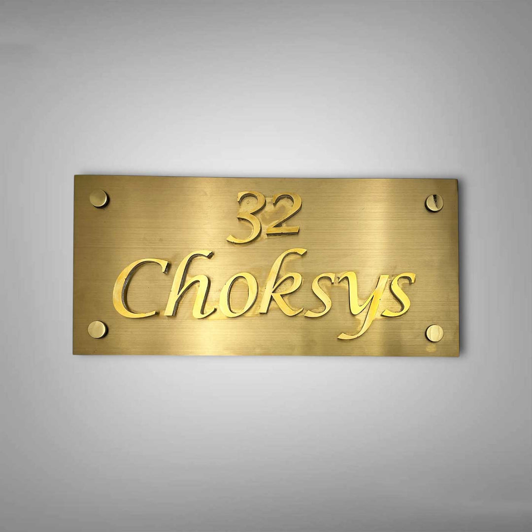 Personalized Weatherproof Rectangle Engraved Gold Stainless Steel Name Plate - Front View on Wall Background