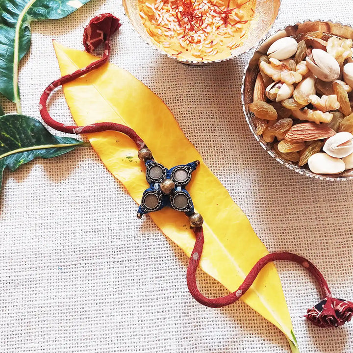 Handmade Dori Work Vintage Ajrakh Rakhi With Roli Chawal - Styled with Decorative Items