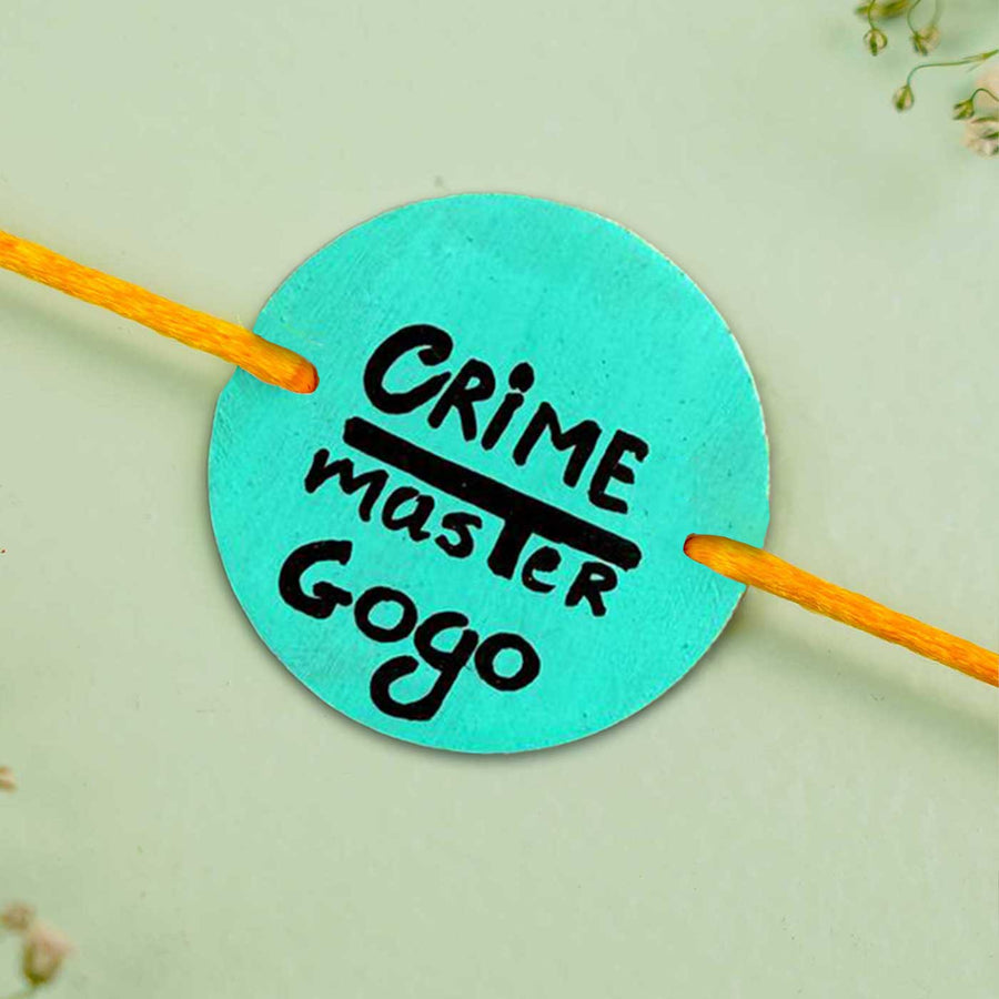Personalized Hand Painted Crime Master Gogo Wooden Rakhi With Roli Chawal - Close-up of Round Tag with String