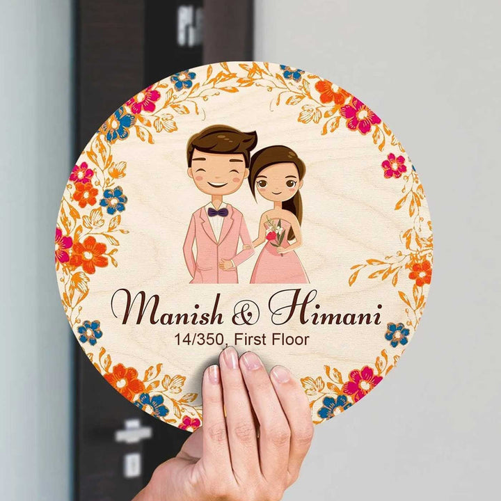 Printed Multicolour Floral Wooden Round Nameplate For Couples - Front View Held by Hand