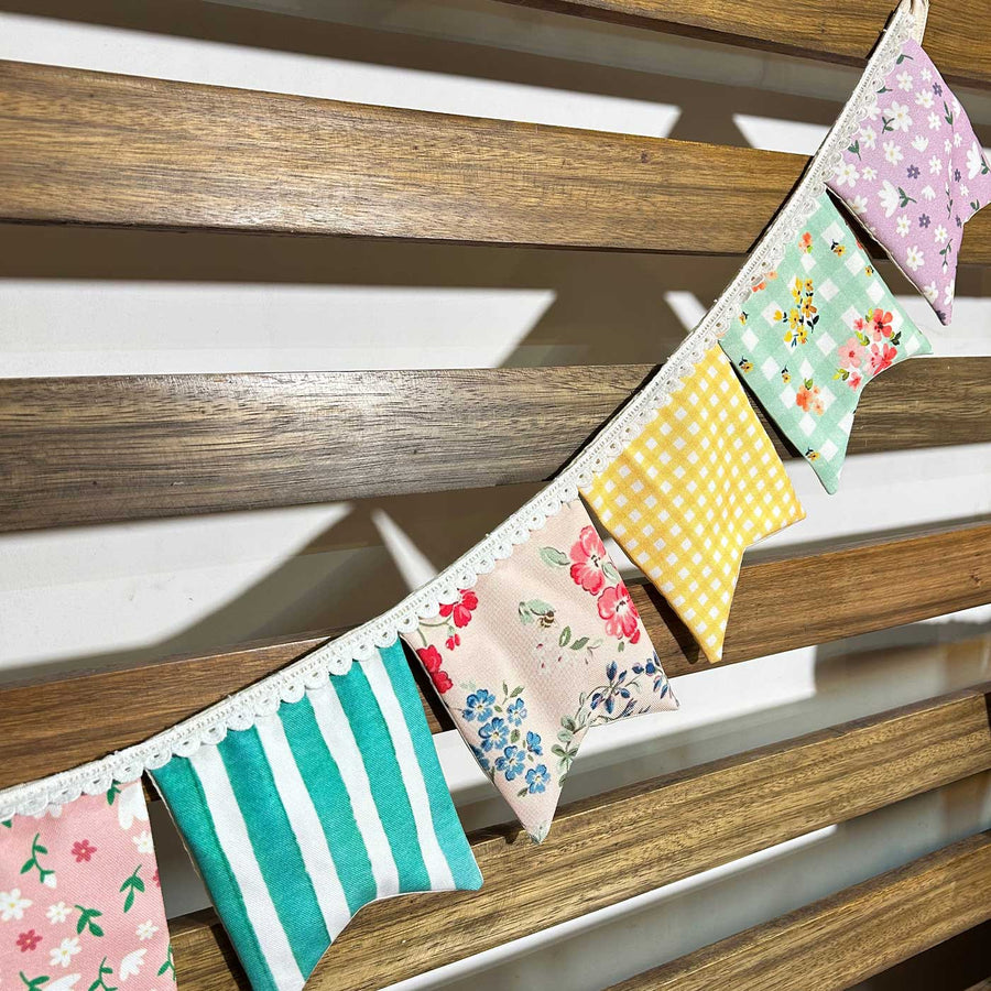 Handmade Multicolour Cotton Bunting - Close-up Hanging on Wooden Slats