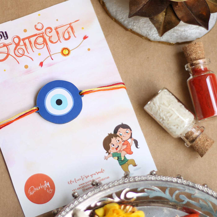 Handmade Evil Eye Design Magnet Wooden Rakhi With Roli Chawal - Styled Presentation with Raksha Bandhan Card