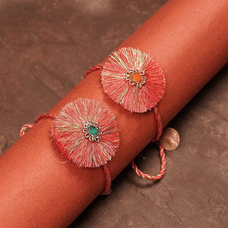 Handmade Round Pink Rakhi With Roli Chawal Set Of 2 - Close-up on Wrist Display