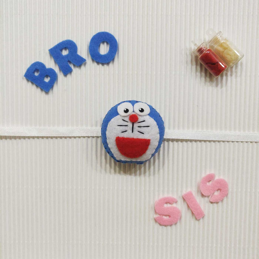 Handmade Doraemon Theme Felt Kids Rakhi With Roli Chawal - Decorated on Ribbon with Letters