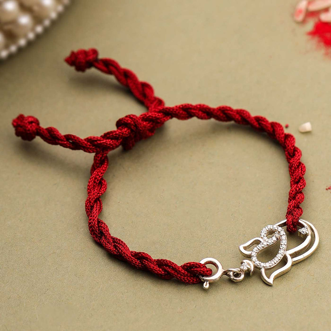 Handmade Ganesha Design Religious Silver Rakhi For Brother - Braided bracelet close-up
