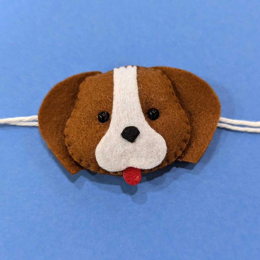 Handmade Puppy Theme Felt Kids Rakhi With Roli Chawal - Front Close-up View