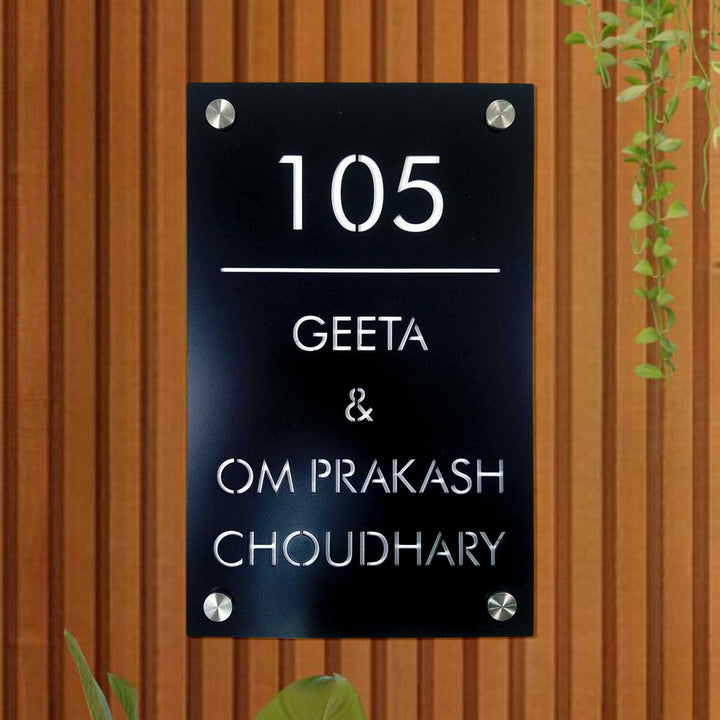 Personalized Sleek Black Acrylic Vertical Name Plate - Mounted on Wooden Wall Close-up
