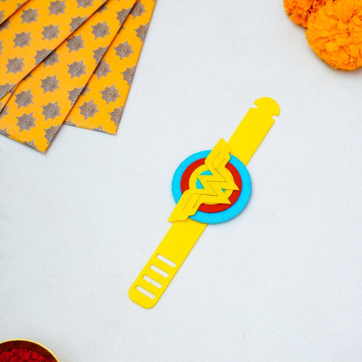 Kids Theme Felt Rakhi Band With Roli Chawal 5 - Flat lay with decorative elements