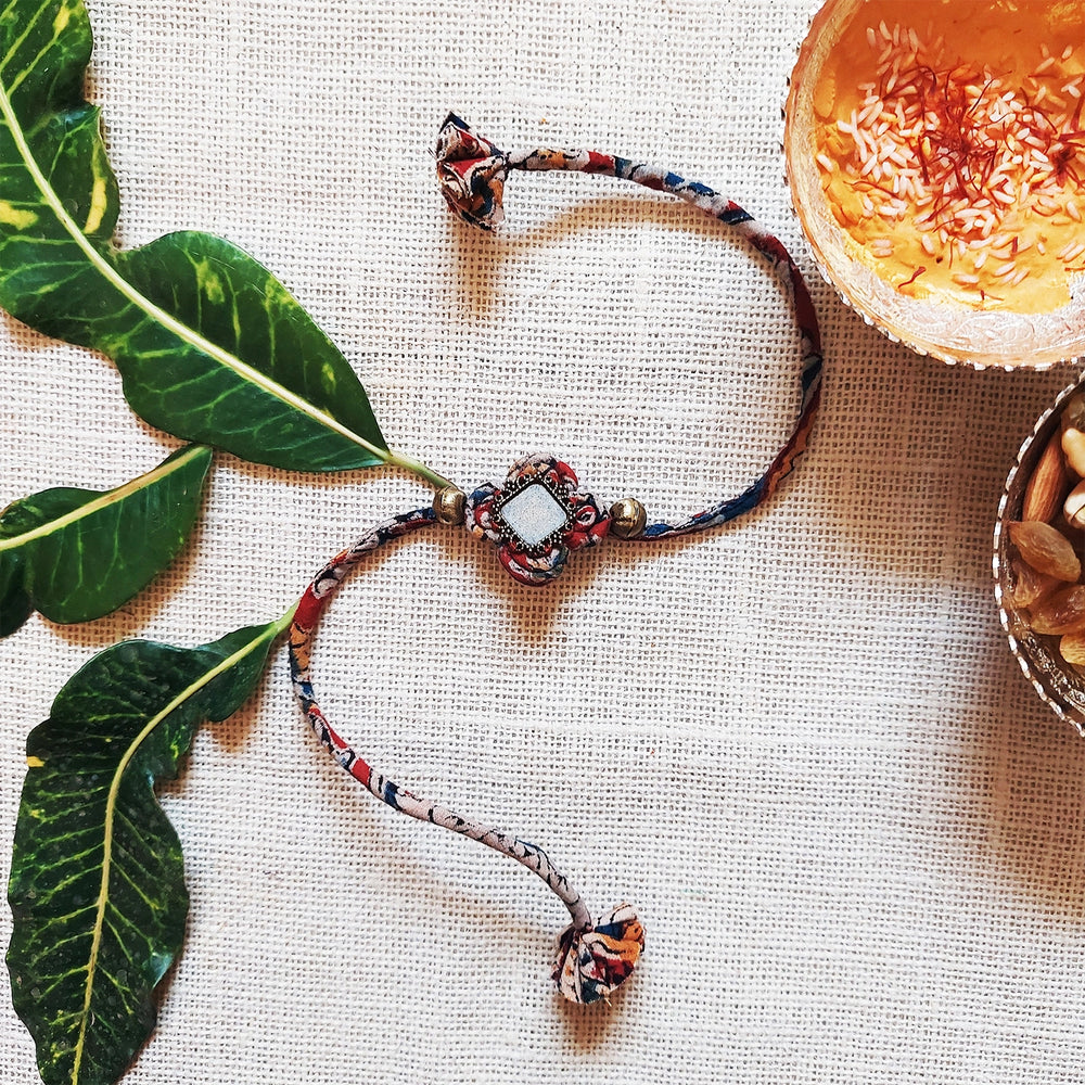 Handmade Dori Work Beaded Ethnic Rakhi With Roli Chawal - Full view with styling elements