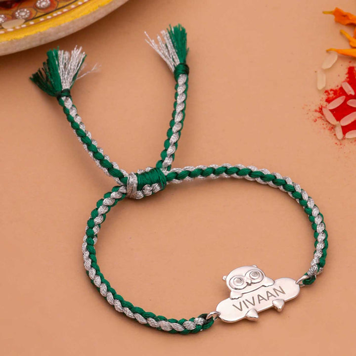 Personalized Handmade Owl Design Silver Kids Rakhi - Flat Lay Front View