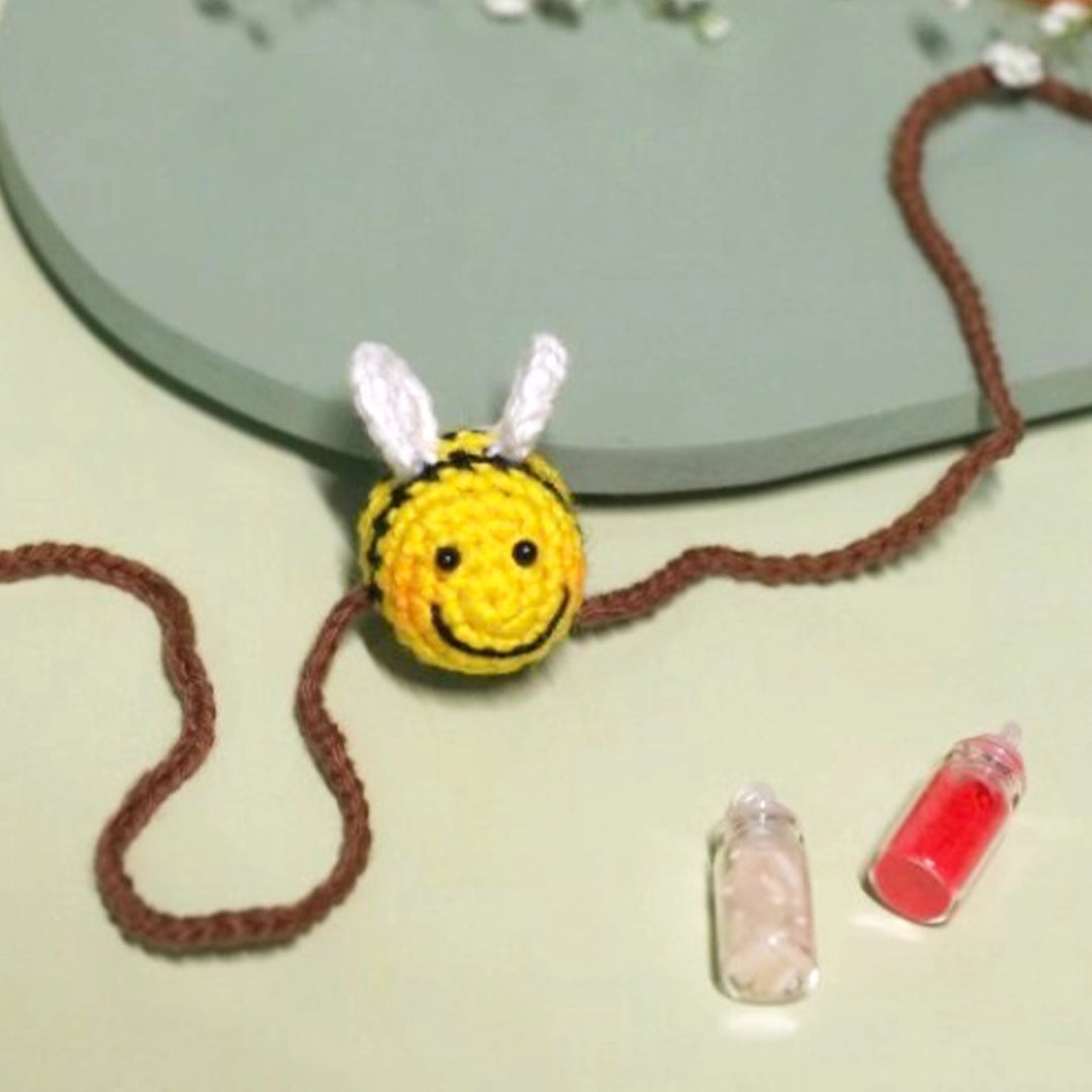 Handmade Crochet Honeybee Kids Rakhi With Roli Chawal - Close-up of Bee Detail