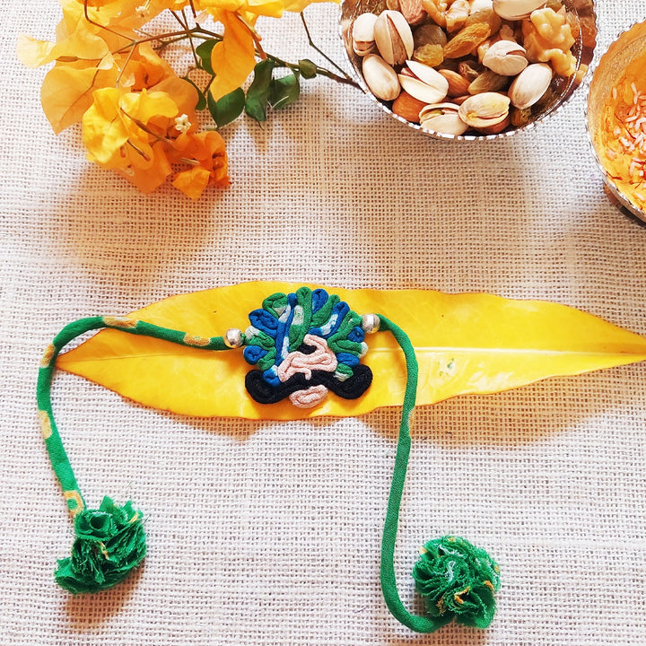 Handmade Dori Work Ethnic Rabari Rakhi With Roli Chawal - Decorative Green Thread Bracelet Display