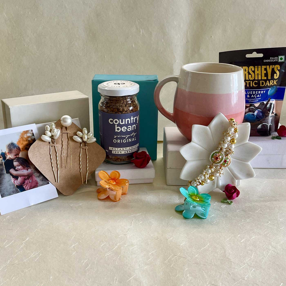 Photo Personalized Handmade Threads And Treasures Rakhi Hamper Includes 1 Mug 2 Clips 5 Photos 3 Hair Pin 1 Marble Lotus 1 Chocolate 1 Coffee And 1 Set Rakhi - Gift Box Items Arranged Outdoors
