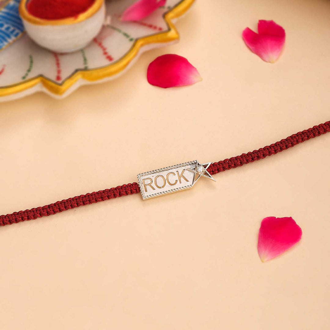 Handmade Rockstar Design Silver Rakhi For Brother - Laid Flat with Decorations