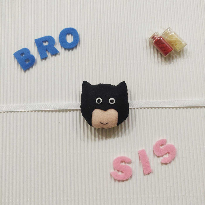Handmade Batman Theme Felt Kids Rakhi With Roli Chawal 10 - Front View with "BRO" and "SIS" Labels