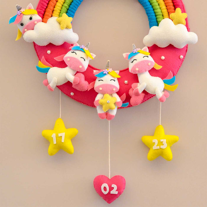 Personalized Rainbow And Unicorn Theme Round Felt Kids Nameplate - Front View Hanging on Hook