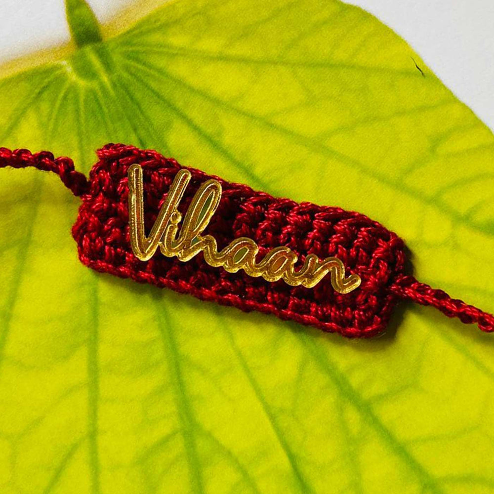 Personalized Handmade Crochet Rectangle Shape Cotton Rakhi With Roli Chawal - Close-up of Name Detail