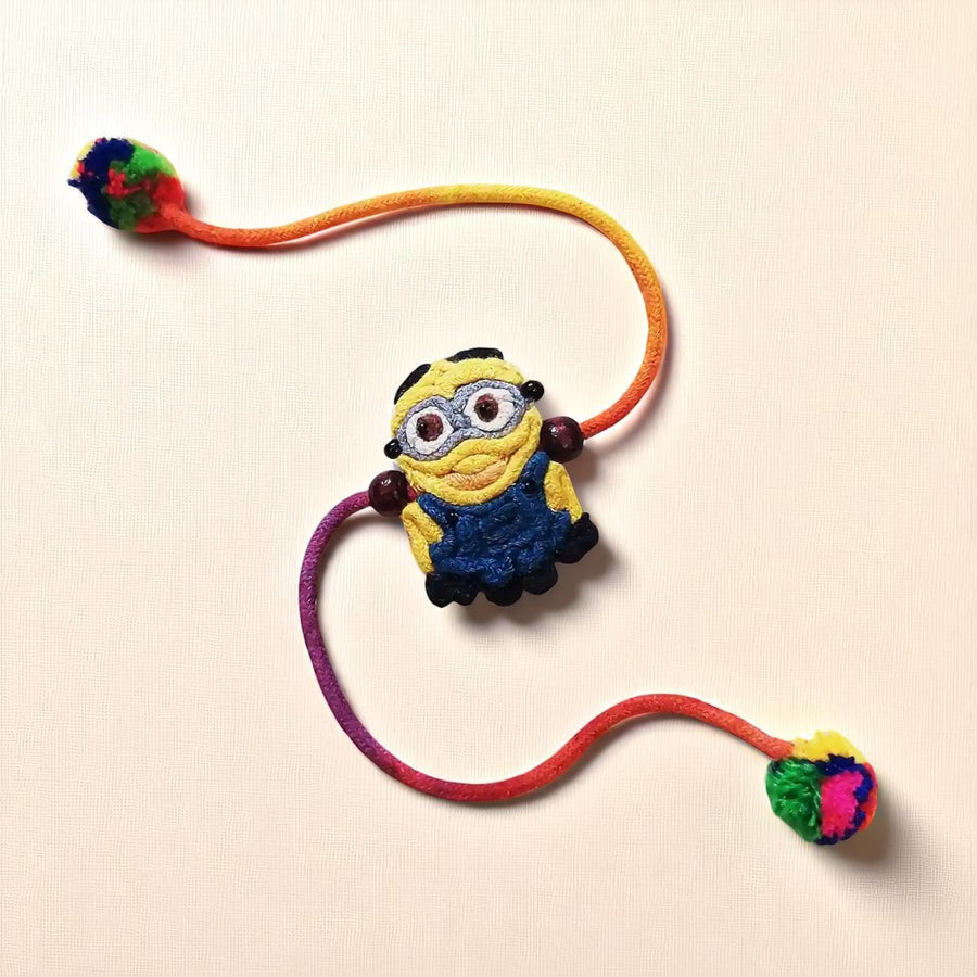 Handmade Dori Work The Minion Kids Rakhi With Roli Chawal - Front View