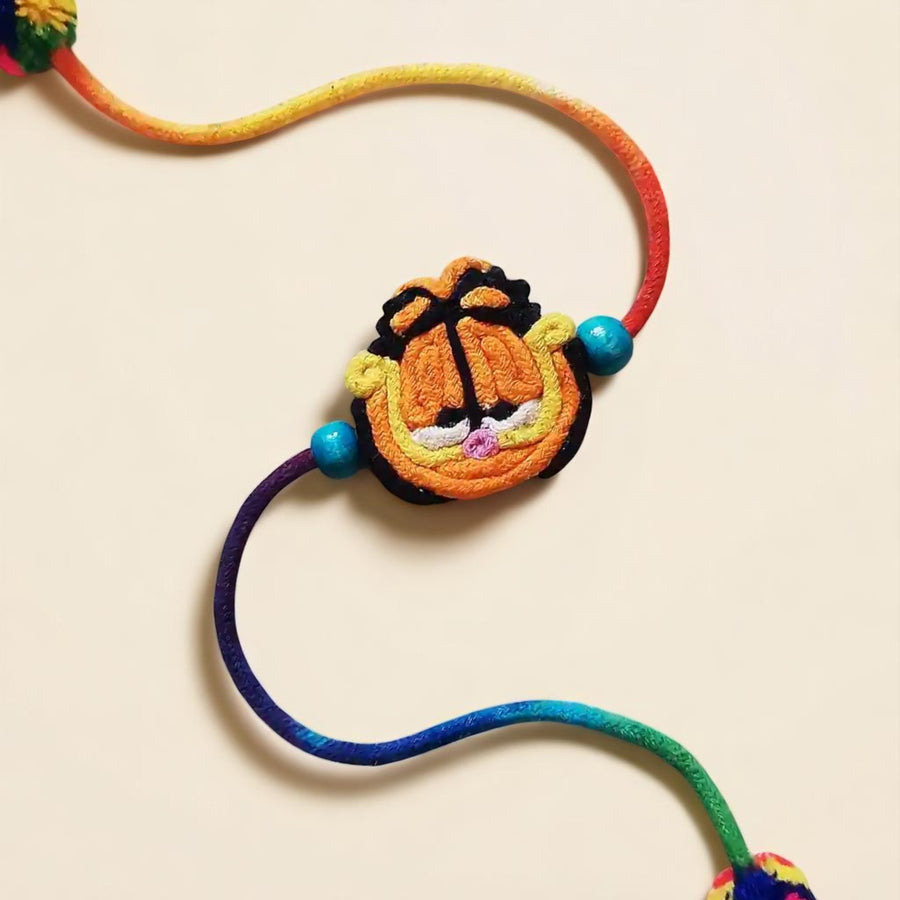 Handmade Dori Work Garfield Kids Rakhi With Roli Chawal - Close-up on Cartoon Charm