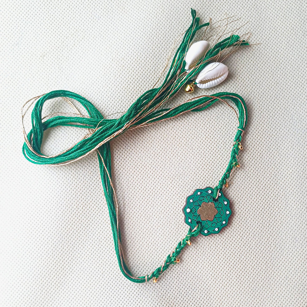 Handmade Green Ghungroo Shell And Beads Wooden Lumba Rakhi For Bhabhi With Roli Chawal - Full product laid flat
