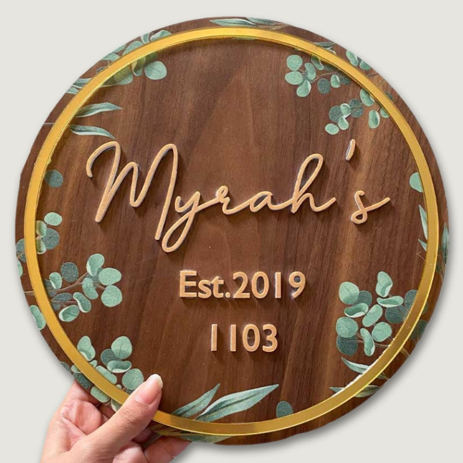 Personalised Wooden Floral Round Nameplate Copy 2 - Front View with Hand Holding