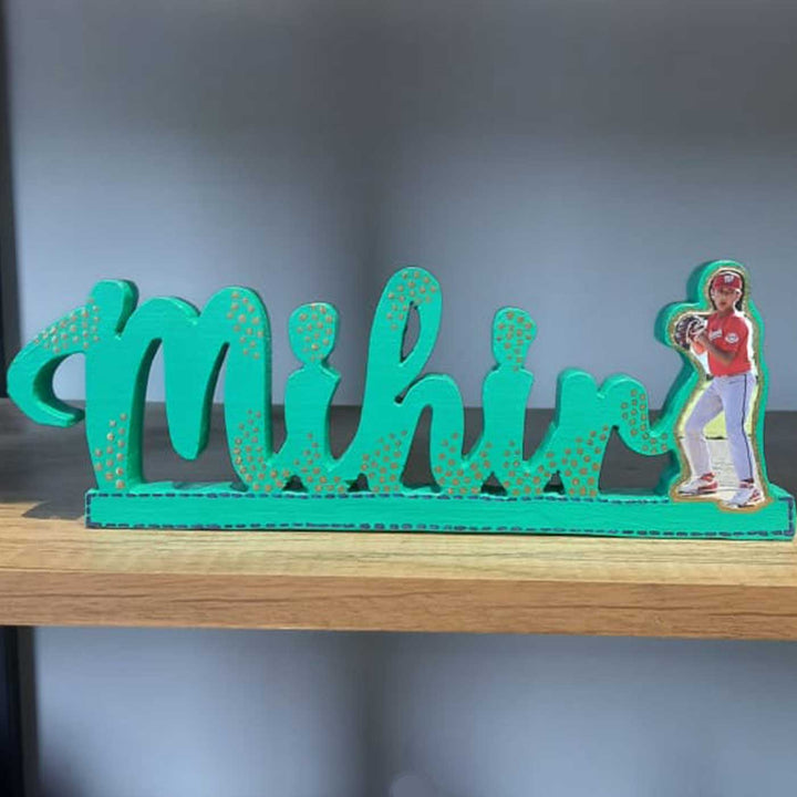 Personalized Handmade Kalakaar Wooden Cutout Name Plate For Boys - Front View on Shelf Display