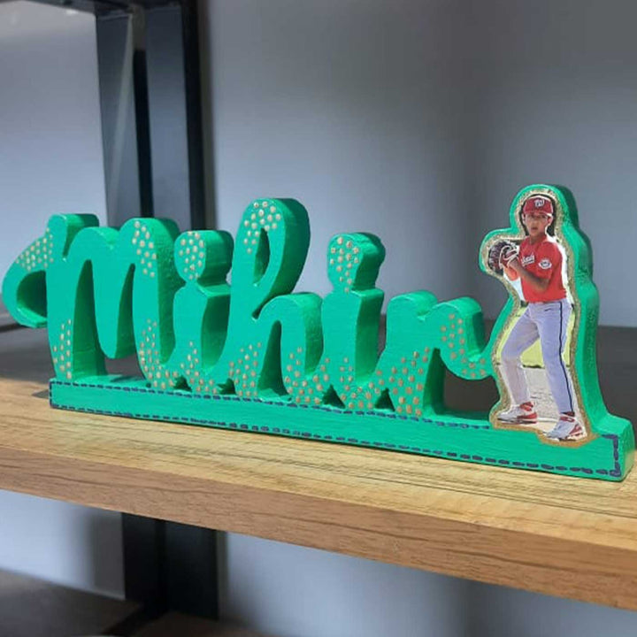 Personalized Handmade Kalakaar Wooden Cutout Name Plate For Boys - Side View on Shelf Display
