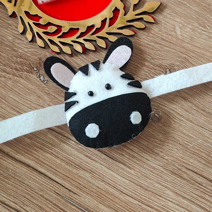 Handmade Zebra Theme Felt Kids Rakhi With Roli Chawal - Close-up View