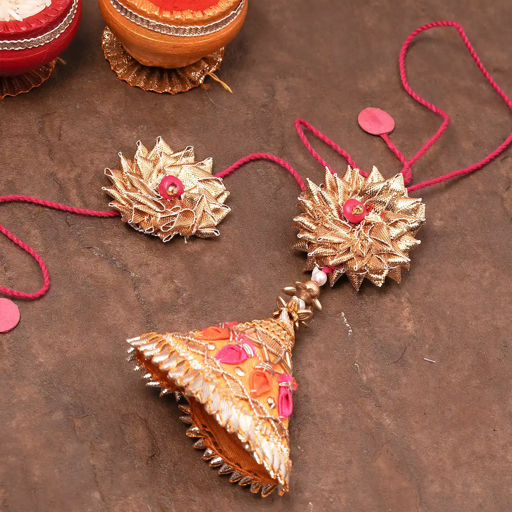 Handmade Swarn Sneh Bhaiya Bhabhi Rakhi With Roli Chawal Set Of 2 - Angled Close-up with Decorative Elements